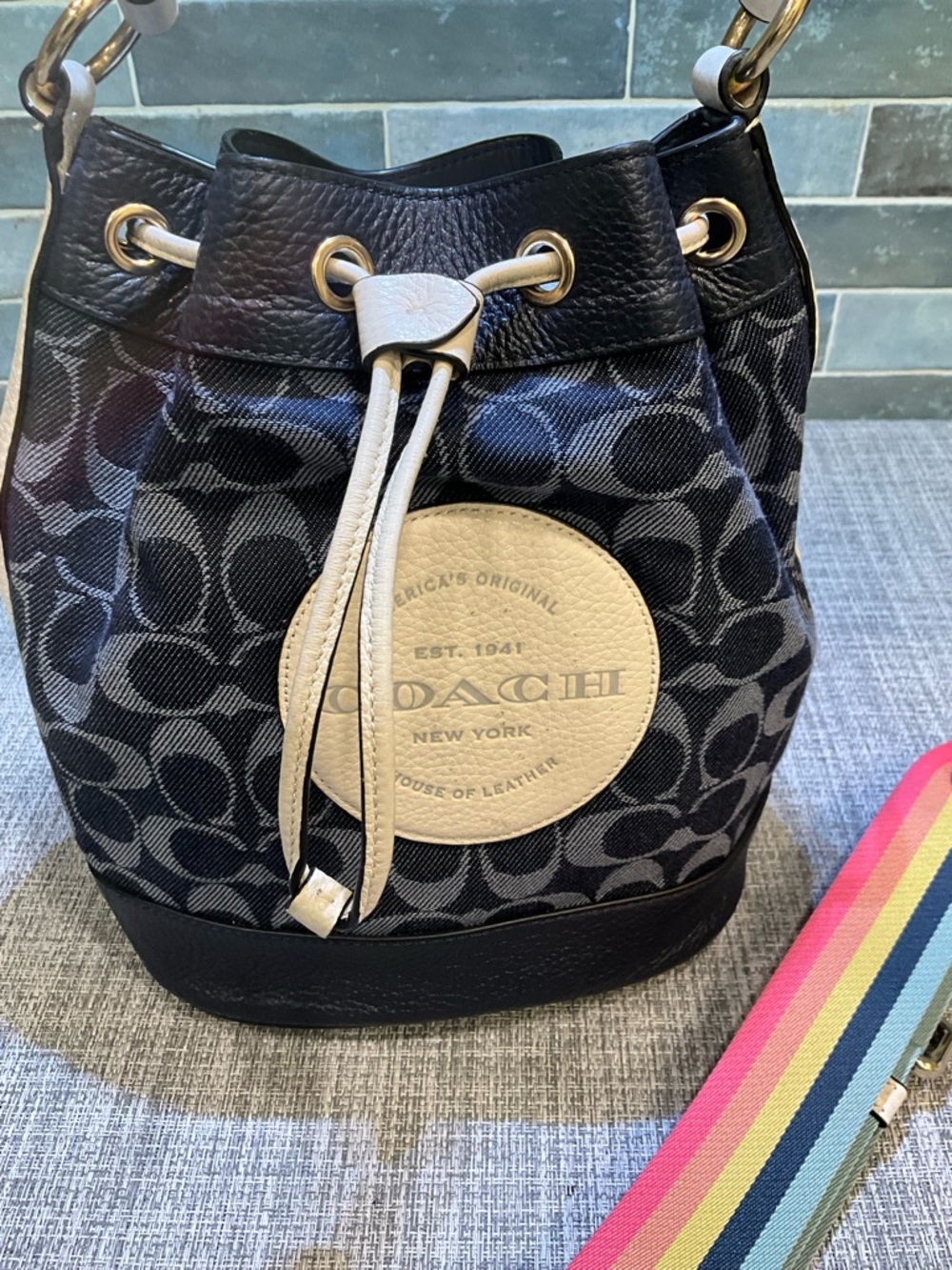Coach Dempsey Navy Signature Bucket Bag with Tan Accents and Rainbow Strap - Picture 2 of 12